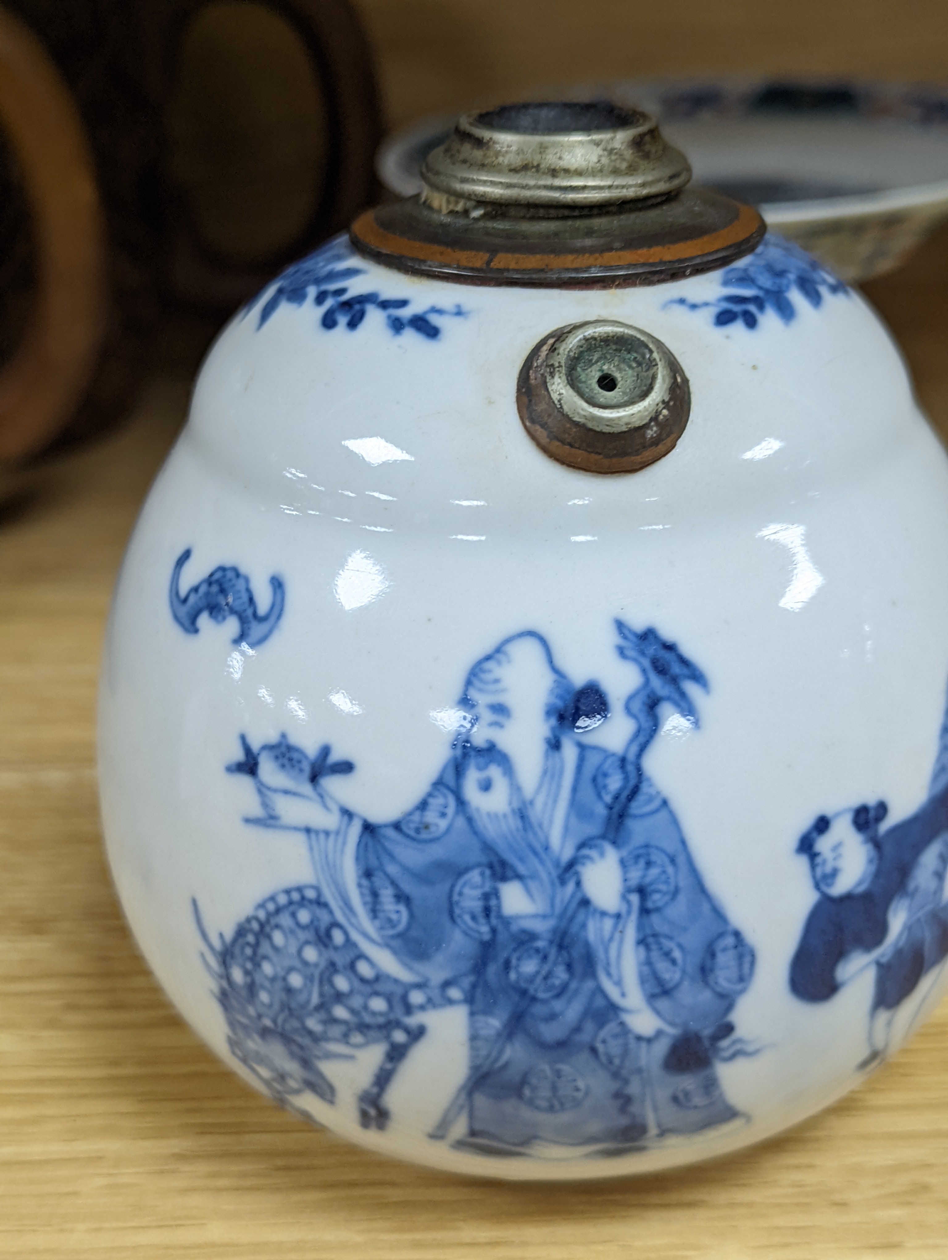 A Chinese blue and white water pipe vessel, a doucai stem dish and a Japanese Imari bowl, 19th century, (3)